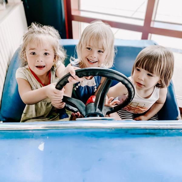 Kids enjoying a bumper-car at the Silver Beach Carousel. 