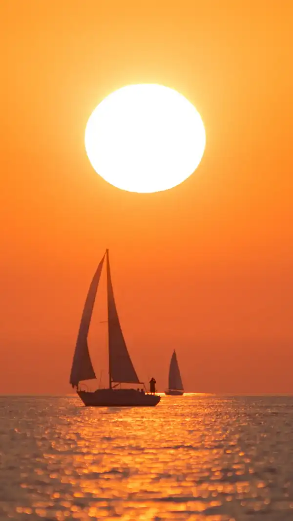 Sailboat on Lake Michigan at sunset.