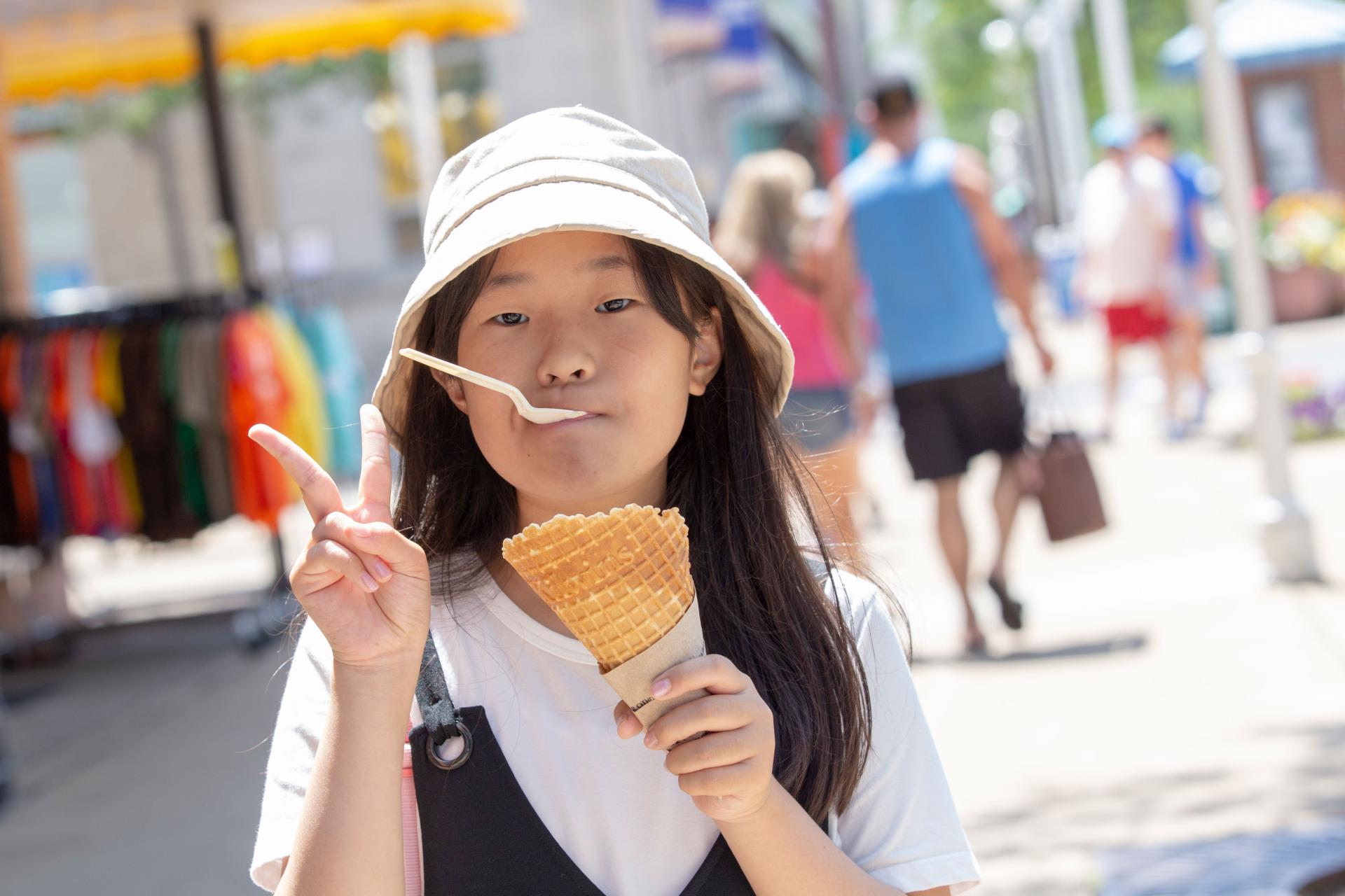 A-girl-enjoying-ice-cream-from-a-waffle-cone