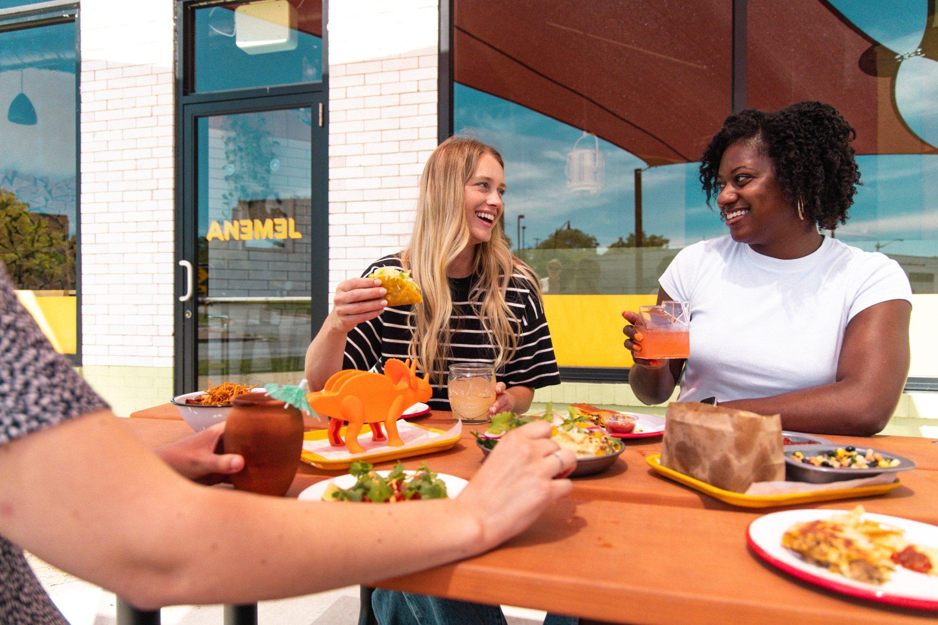 Anemel-2 women eating tacos outside