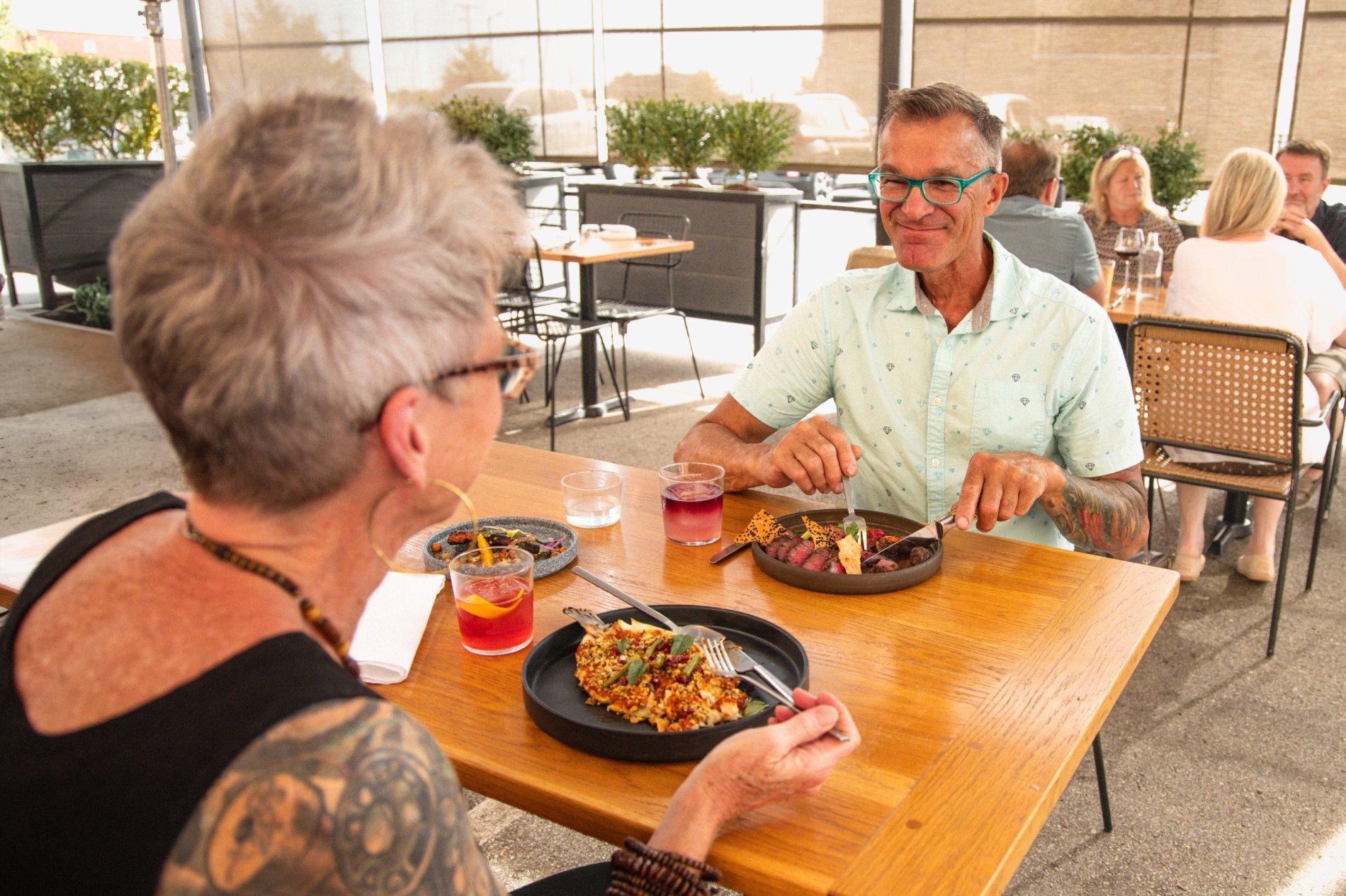 Houndstooth Restaurant-Older Couple Dining Outside-2024