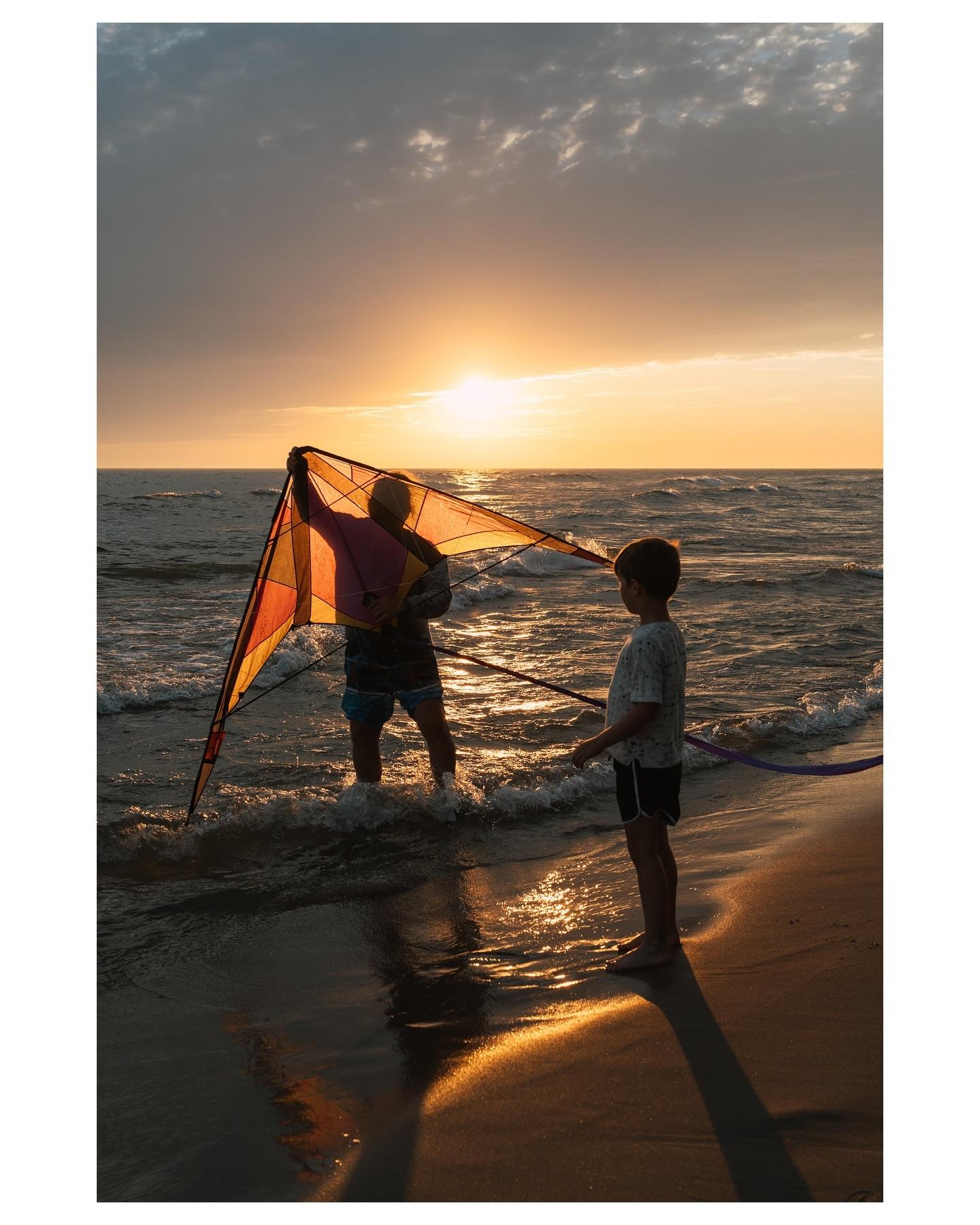 Man holding a kite for a child IG photo @call.me.tbone 