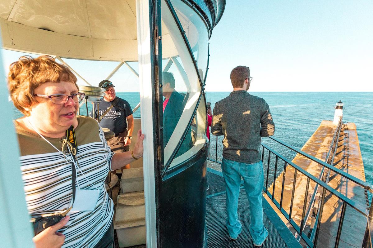 a group enjoying the heritage museum light house tour in st. joseph