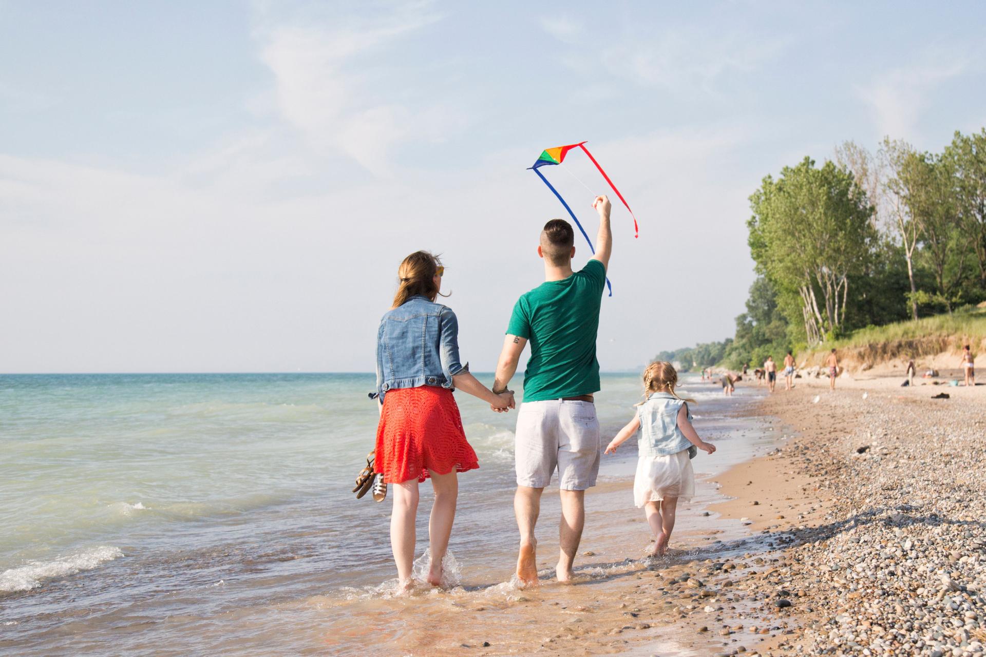 Grand mere state park-a family with a kite walks on the beach