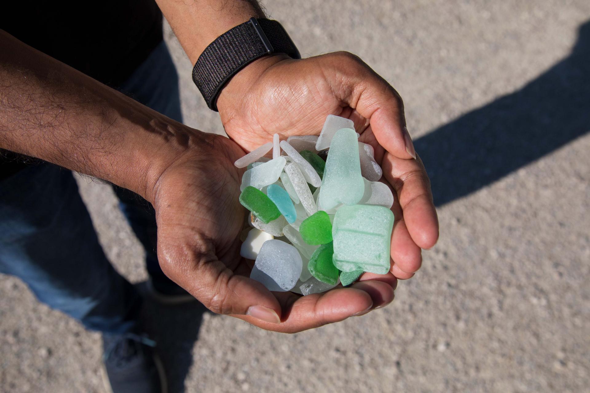 hands filled with beach glass