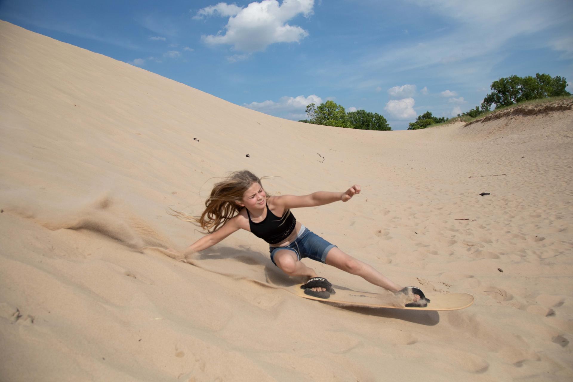 Warren Dunes-a girl sandboarding