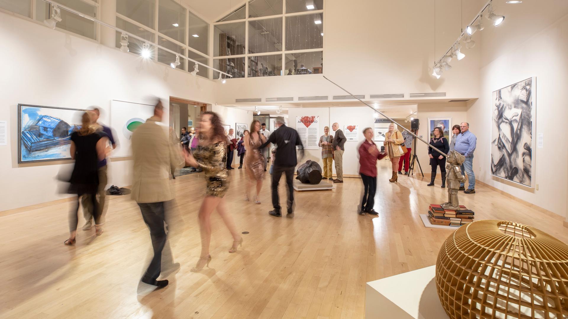 Krasl Art Center- a group of people dancing in an art gallery