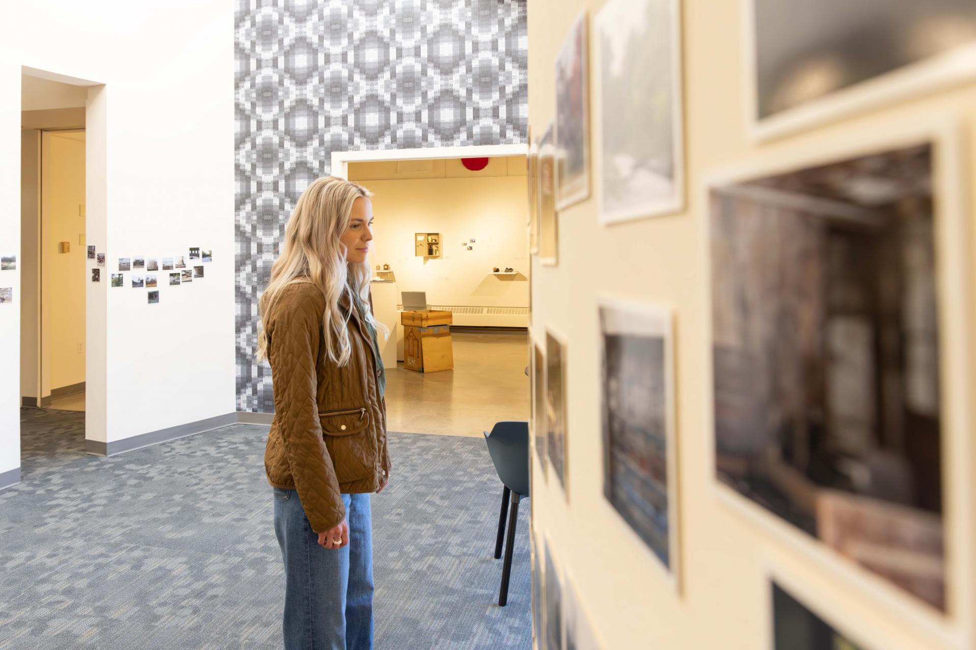 Krasl Art Center-a woman contemplating art in a gallery