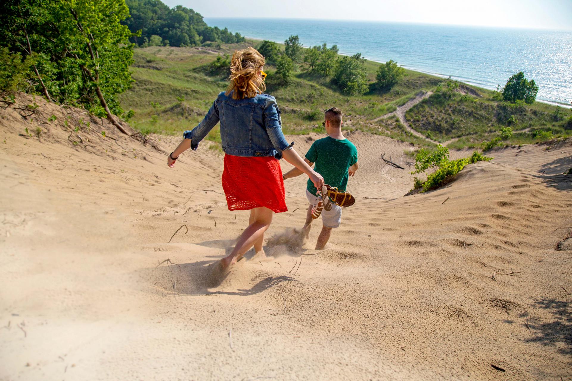 Warren Dunes-a couple running down the dunes