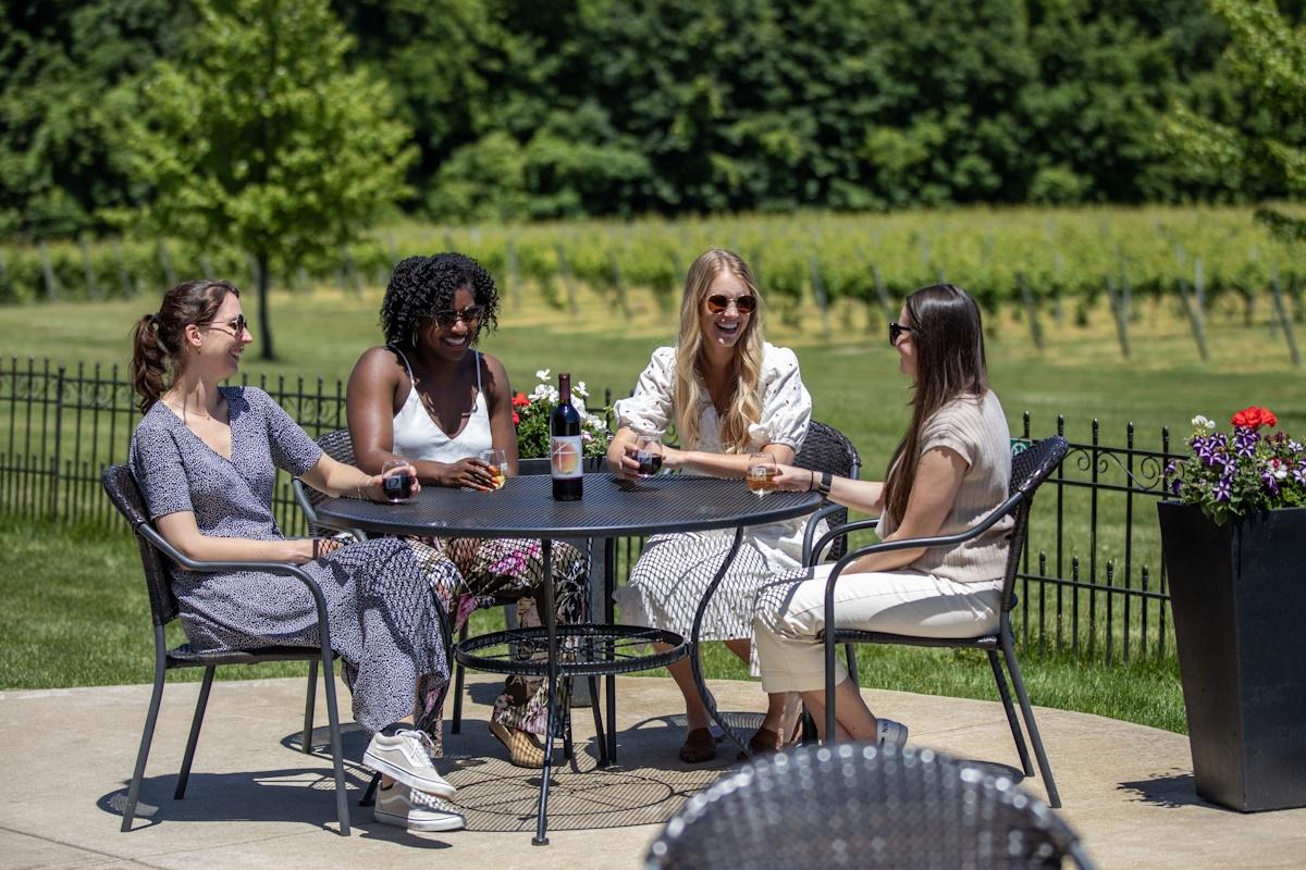 12 Corners-4 girls drinking wine on terrace