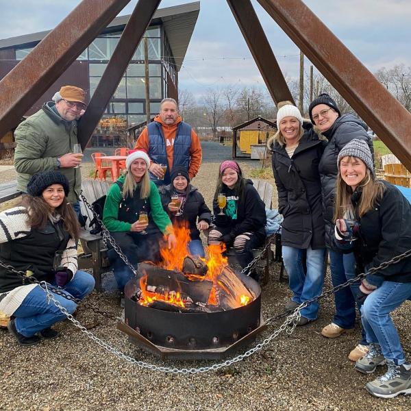 People enjoying a fire at River Saint Joe.