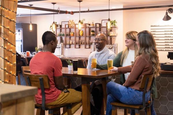 people enjoying drinks at St. Joe Community Taproom