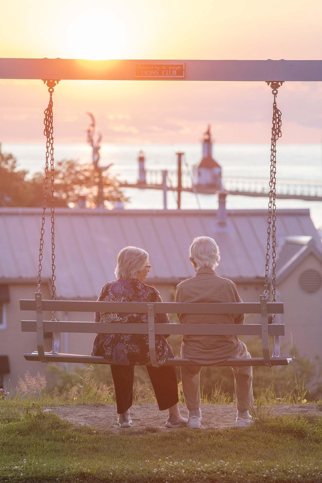 Two people enjoying a sunset in St. Joseph.