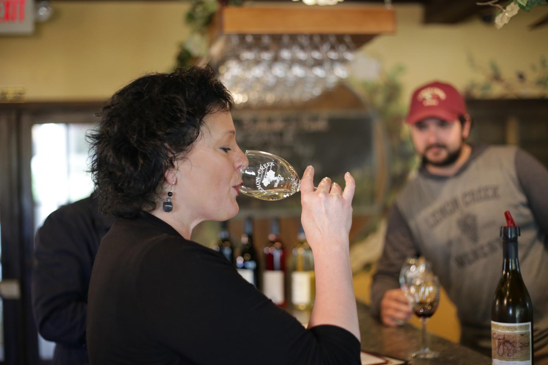 woman drinking wine at Lemon creek winery