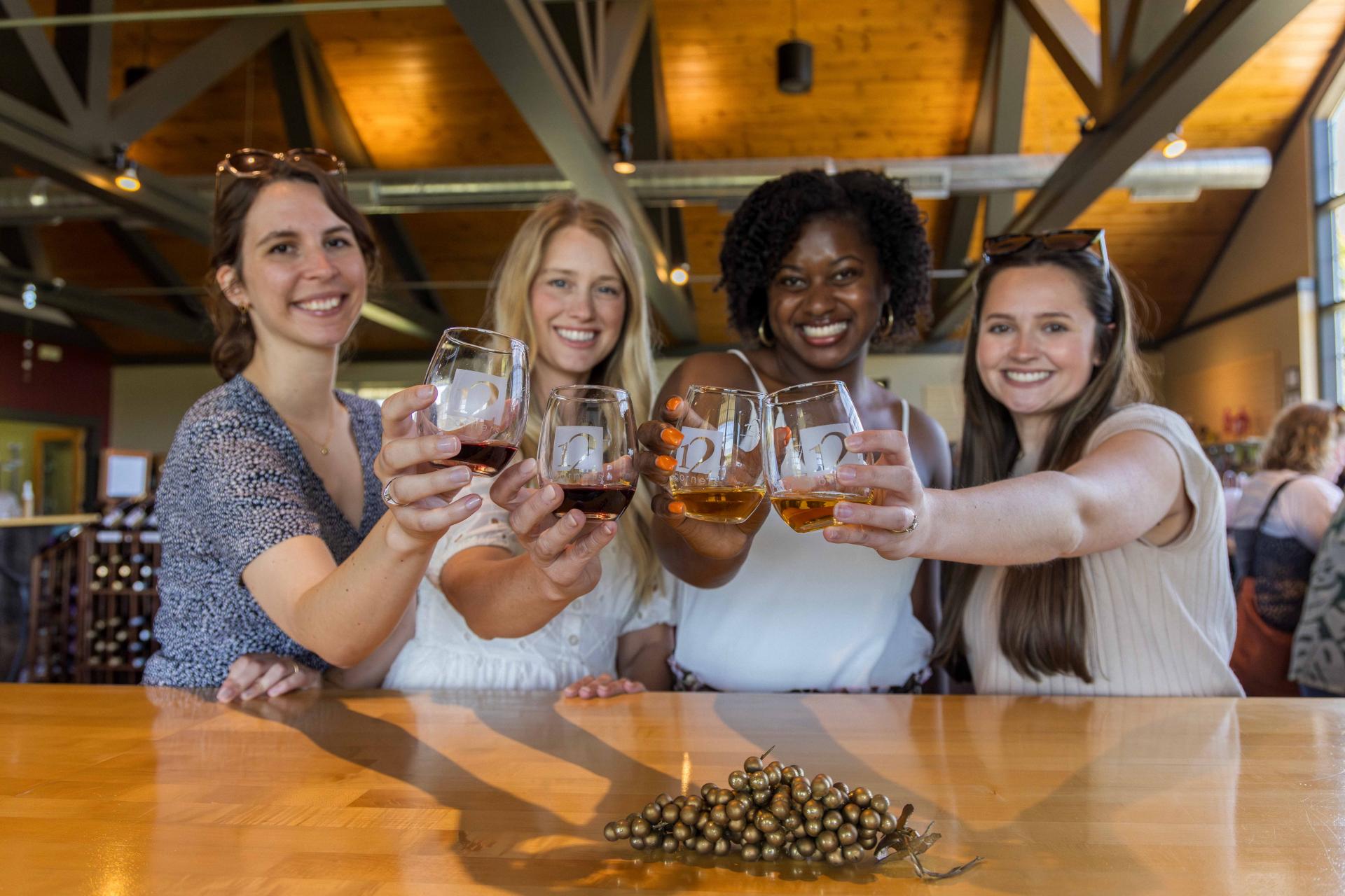 Four girls toasting at 12 corners Vineyards