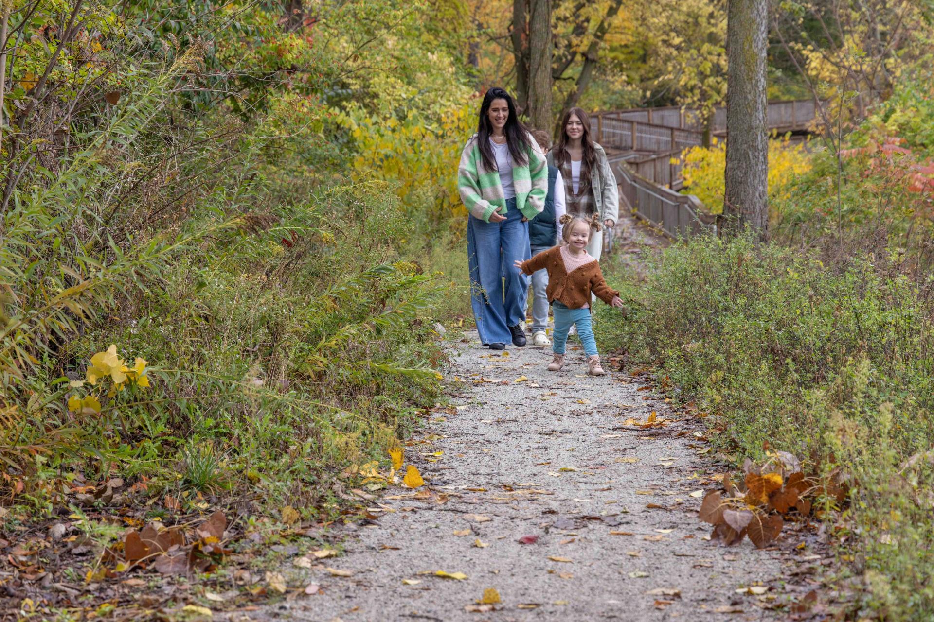 fall family hiking on nature trail