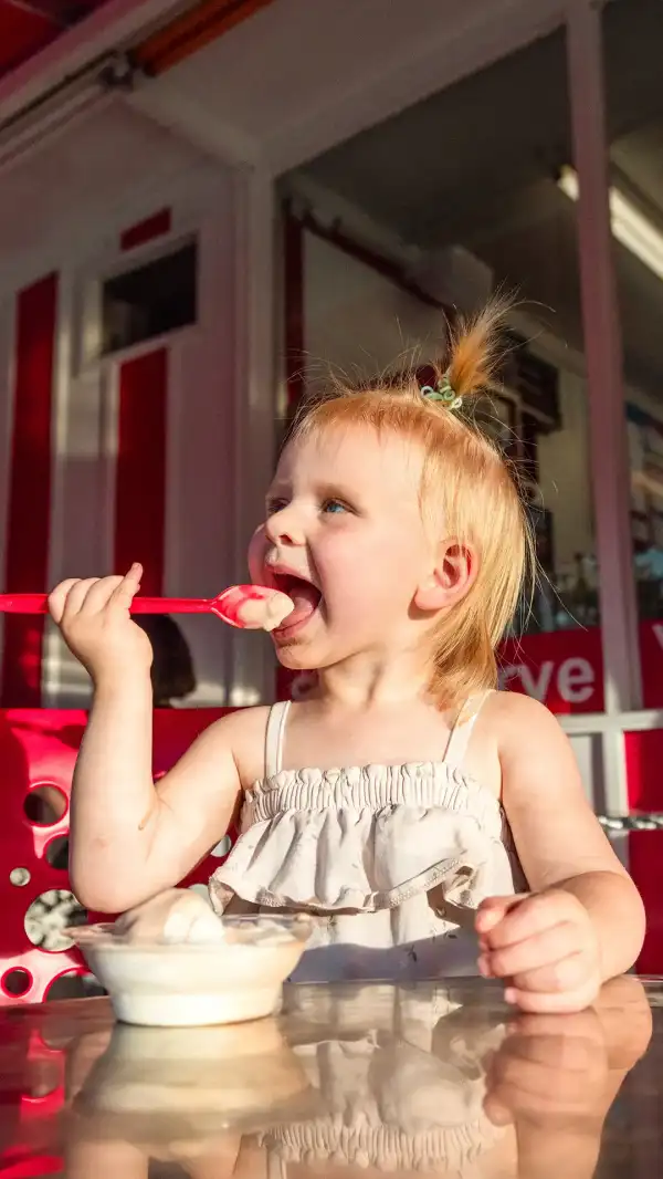 A child eating ice cream at Dairy Corner.