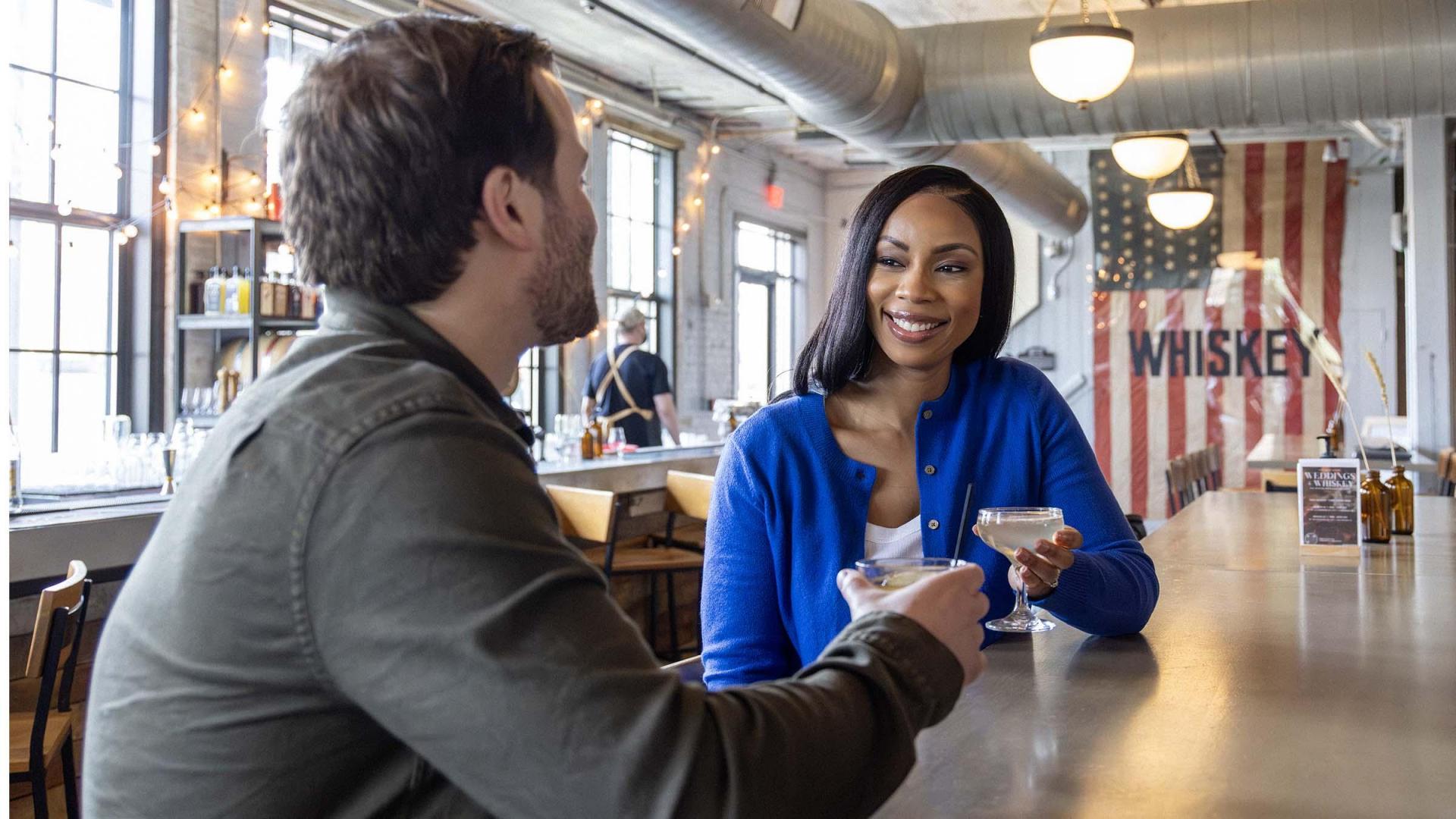 People enjoying cocktails at Journeyman Distillery.