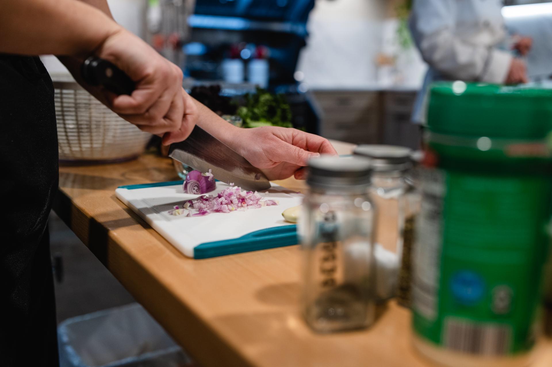 Chopping onions during a cooking class