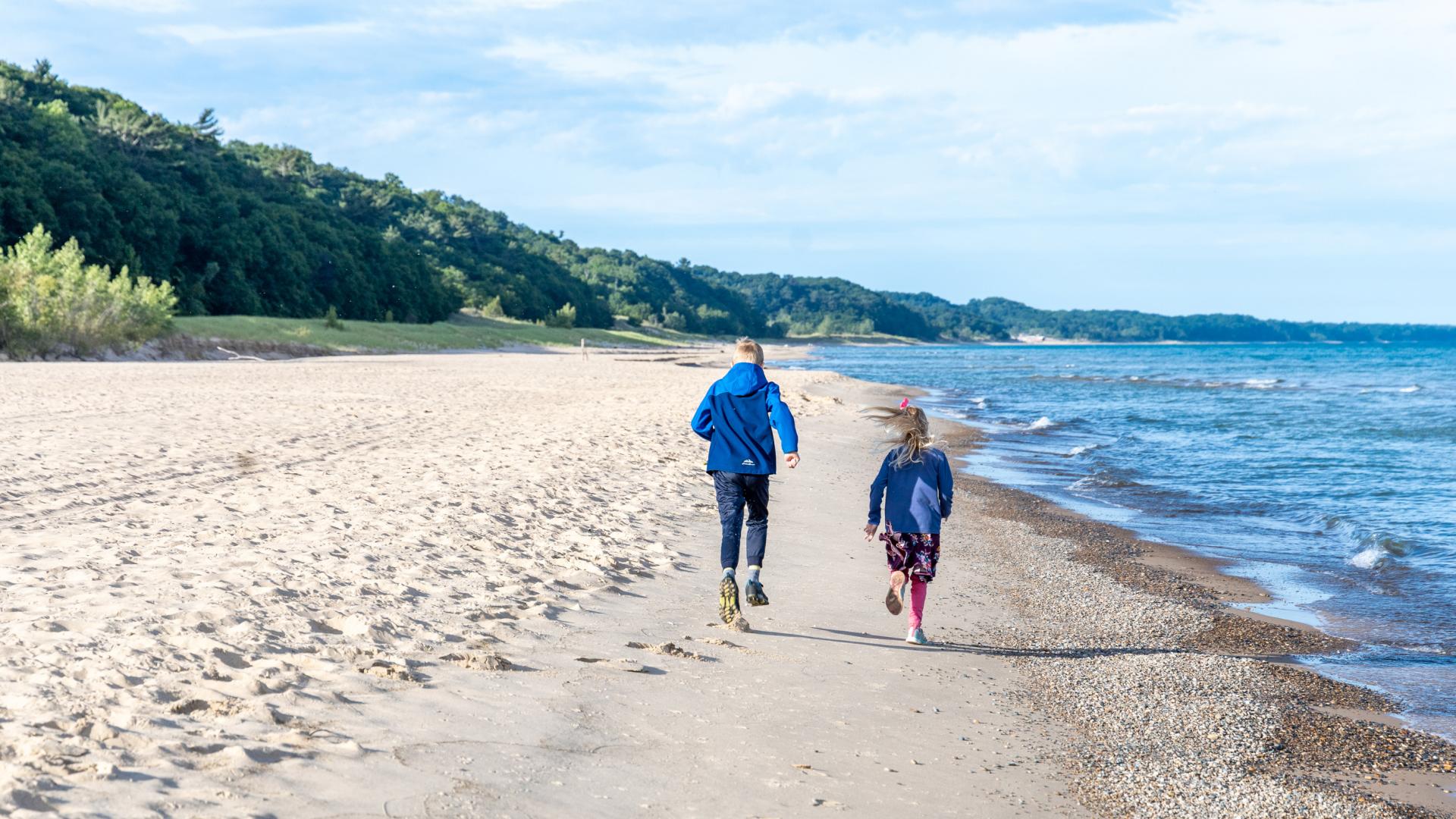 kids running on the beach