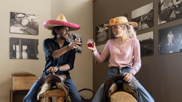 Two people enjoying wine at Baroda Founders.