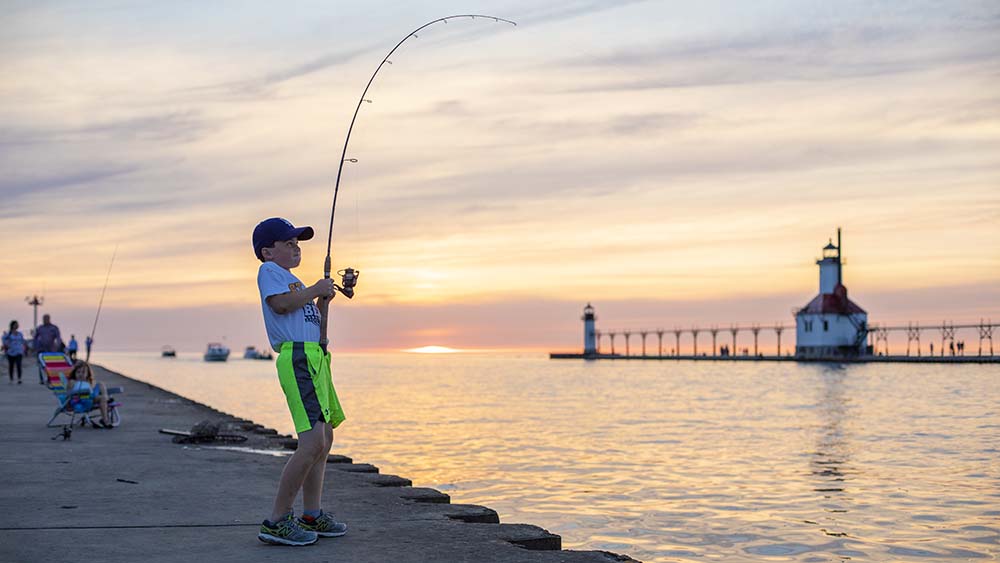 A child fishing from the south pier in St Joseph.