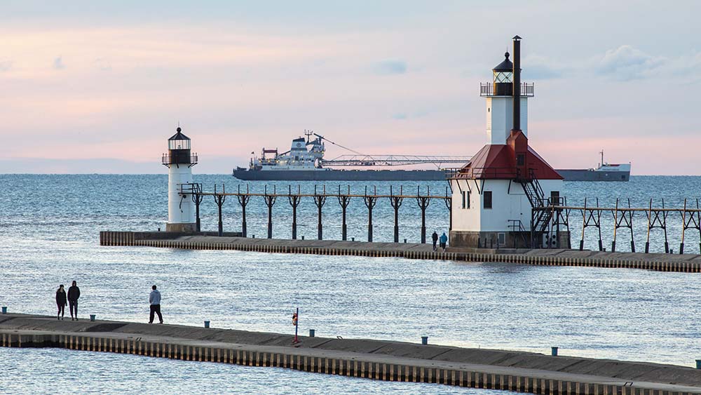 A freighter passing near the lighthouse in St. Joseph, MI