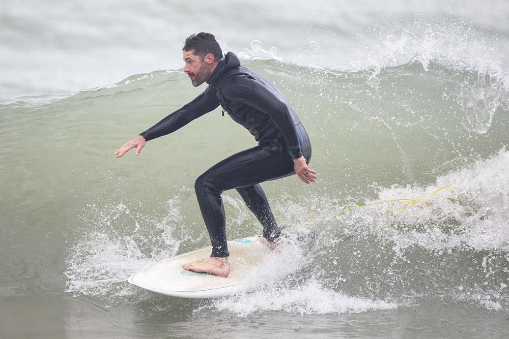 Lake Michigan surfer catching a wave