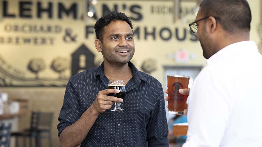 Two people drinking beers at Lehmans