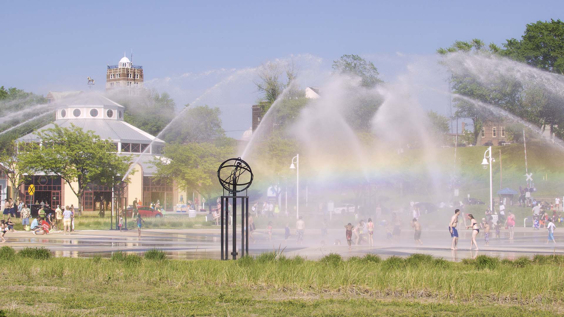 Whirlpool Compass Fountain in the summer with a rainbow