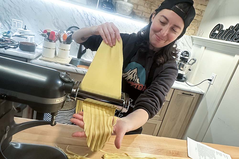 A person making pasta.