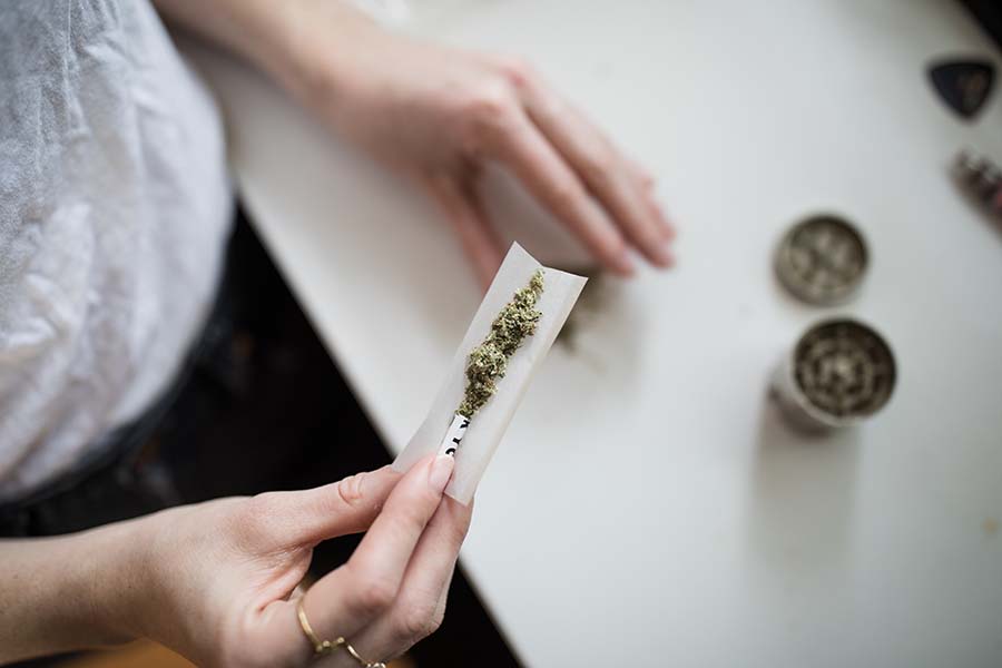 A person rolling a joint