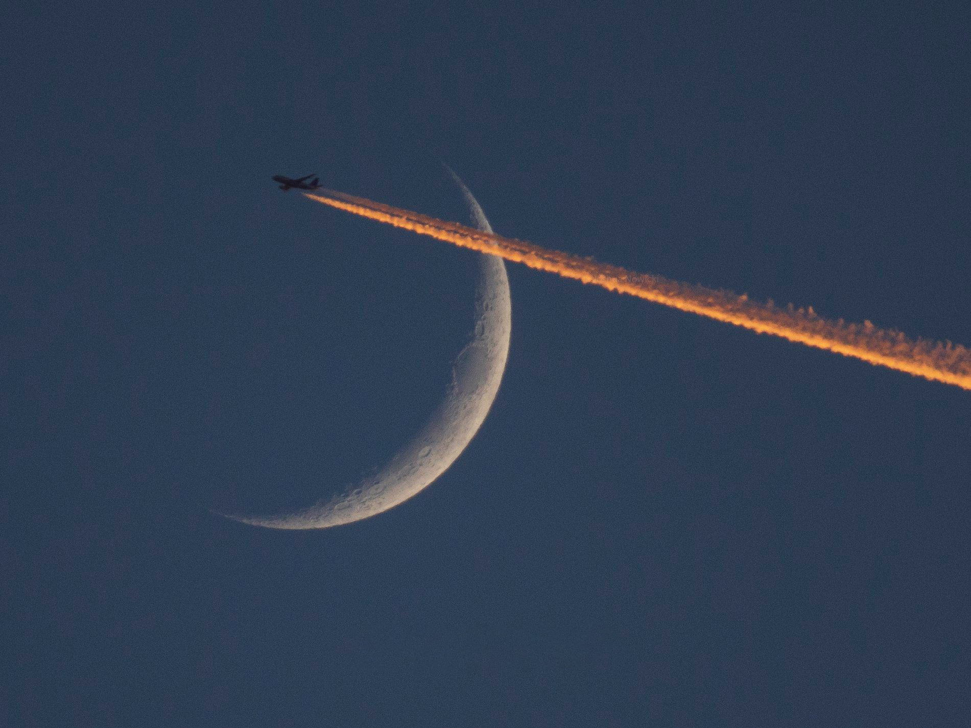 Moon & Airplane photo by Joshua Nowicki