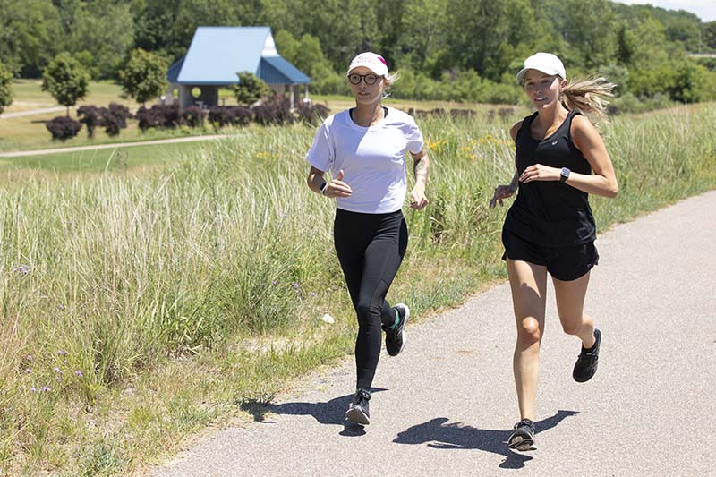 Two people running the Harbor Shores Nature and Fitness Trail System