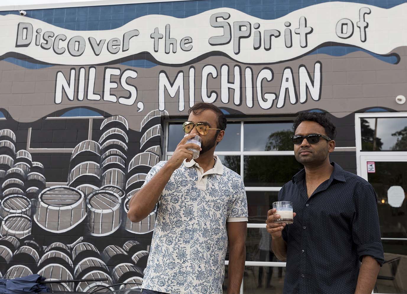 Two men drinking at Iron Shoe Distillery