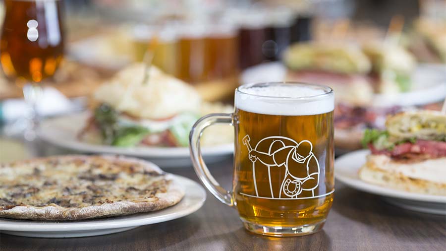 food and beer on a table at the Livery