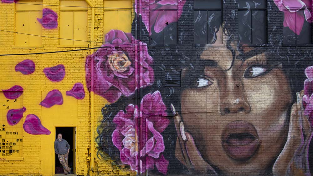 mural of a person and flowers in Benton Harbor