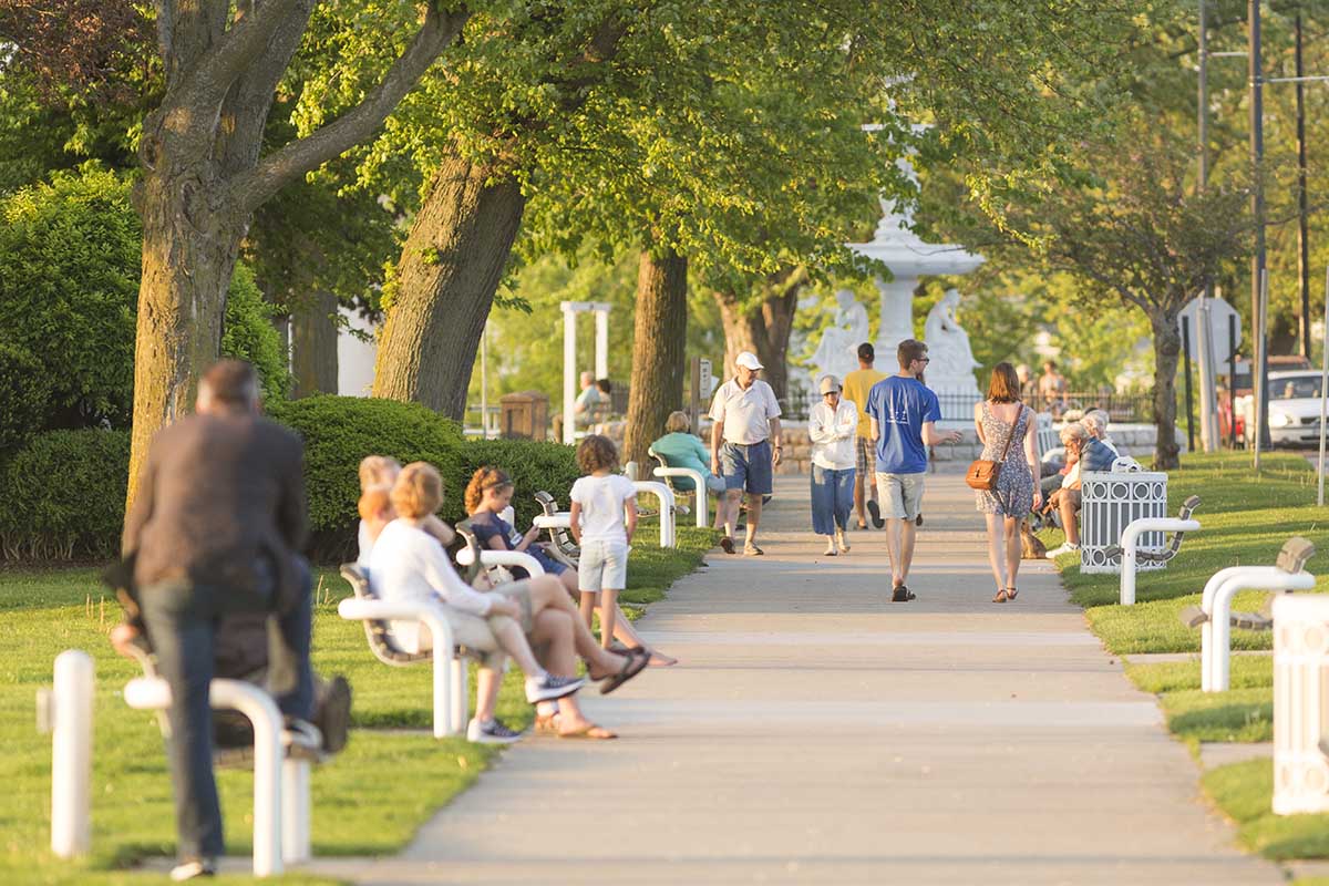 People enjoy a warm spring day on the bluff during their vacation